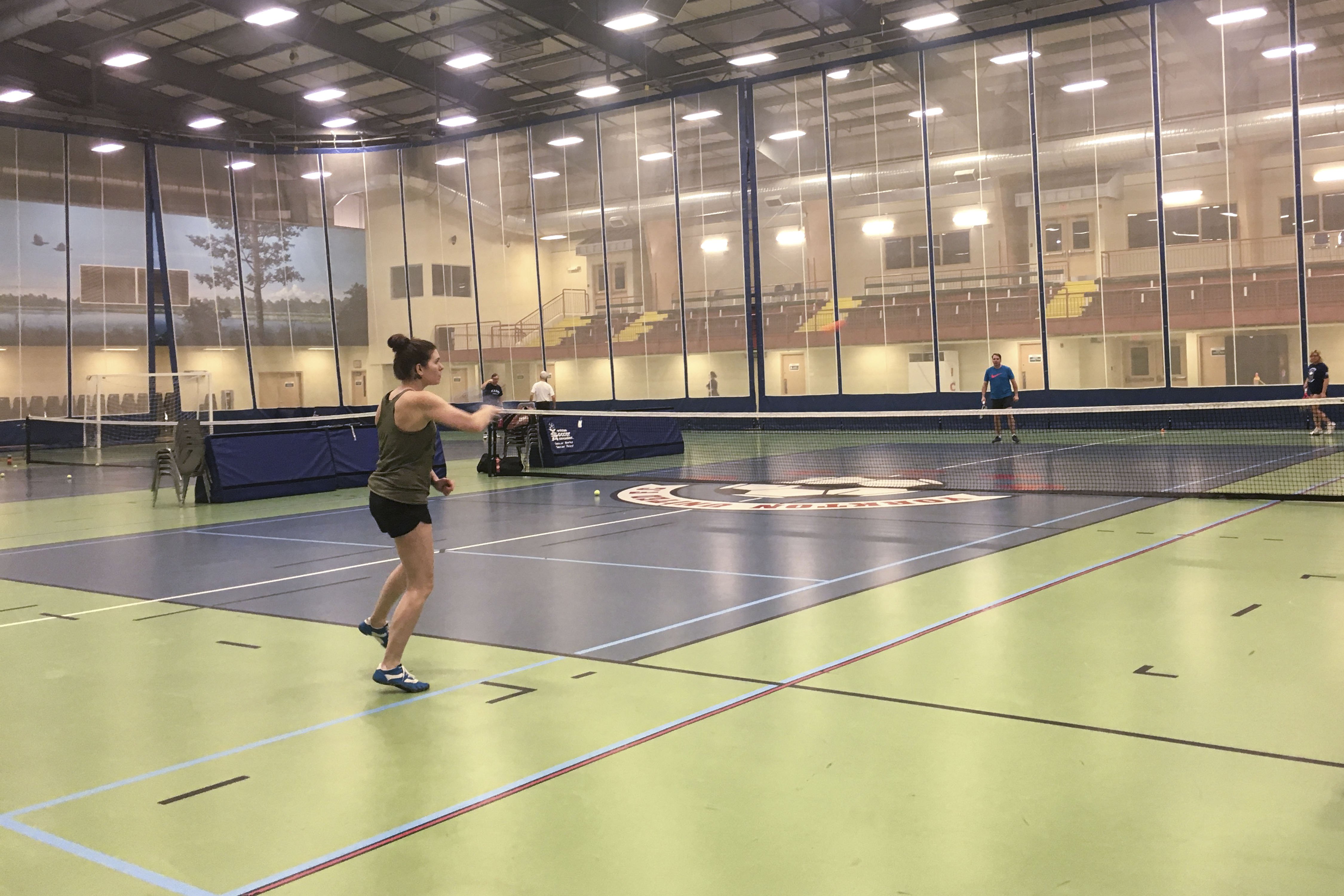 People playing indoor tennis.